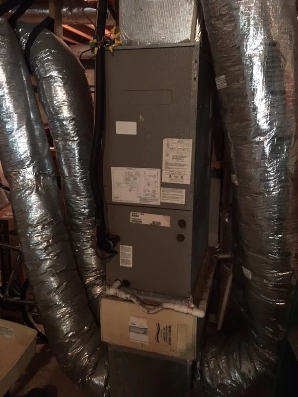 Installed furnace with insulated flex ductwork and copper piping connections